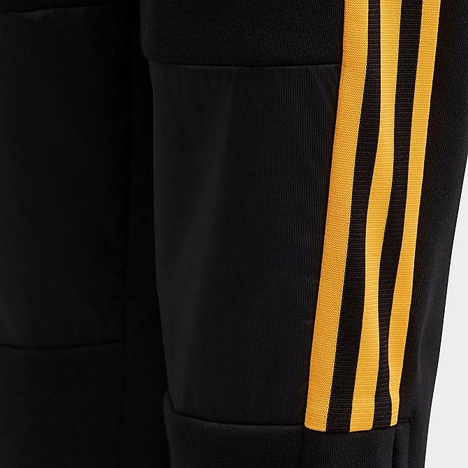 On Model 5 view of Kids' adidas Tiro Winterized Track Pants in Black/Solar Gold Click to zoom