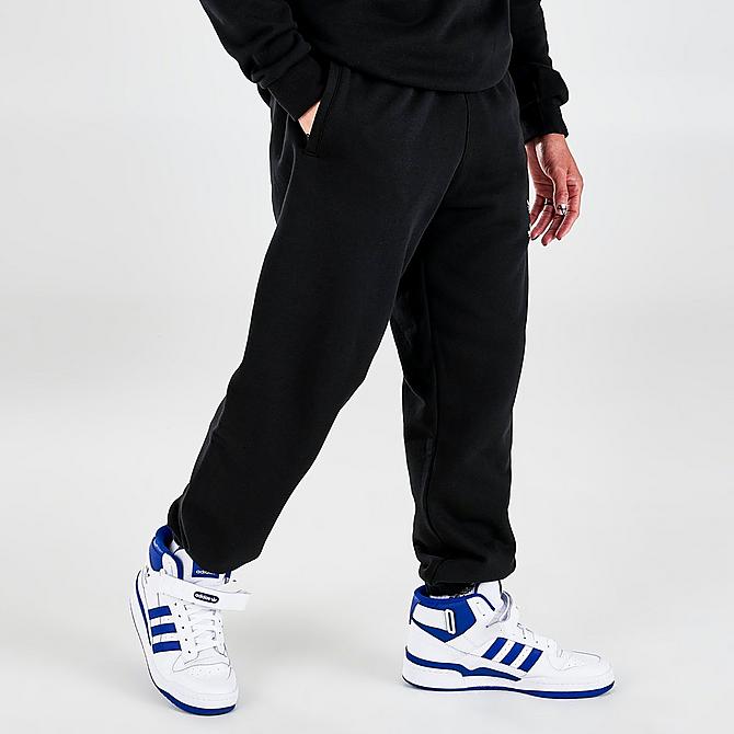 Back Left view of Men's adidas Adicolor Shattered Trefoil Graphic Jogger Pants in Black/Multicolor Click to zoom