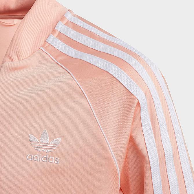 Back Left view of Girls' adidas Originals SST Track Jacket in Haze Coral/White Click to zoom