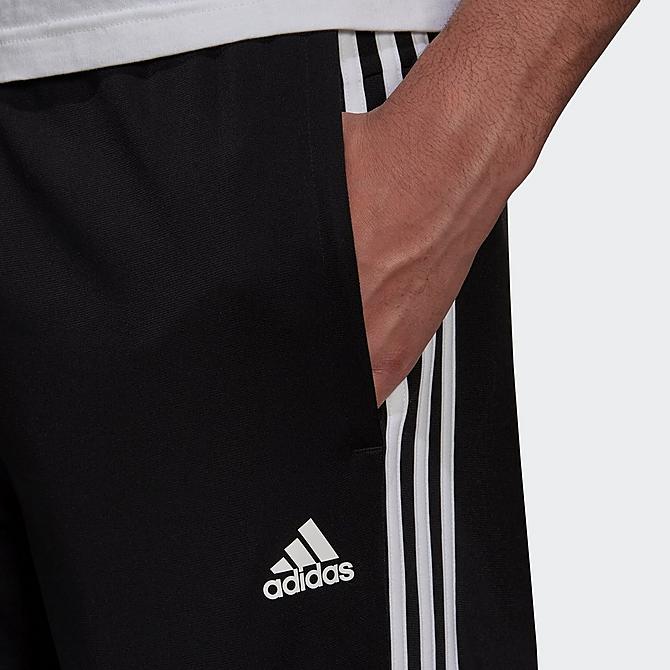 Back Right view of Men's adidas Warm-Up Tricot Open-Hem 3-Stripe Training Pants in Black/White Click to zoom