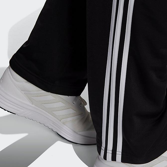 On Model 5 view of Men's adidas Warm-Up Tricot Open-Hem 3-Stripe Training Pants in Black/White Click to zoom