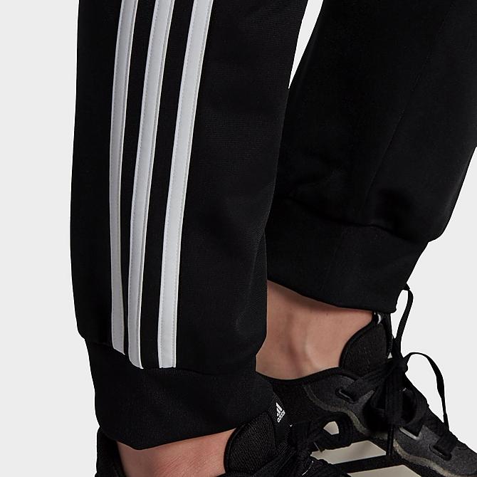 On Model 5 view of Women's adidas Essentials Primegreen Tapered Warm-Up Track Pants in Black Click to zoom