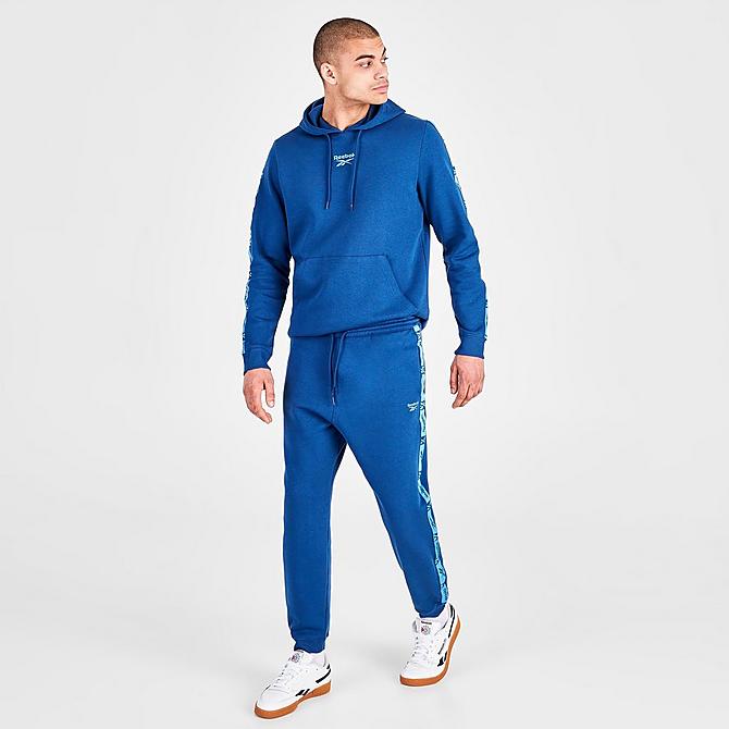 Front Three Quarter view of Men's Reebok Identity Tape Jogger Pants in Batik Blue Click to zoom