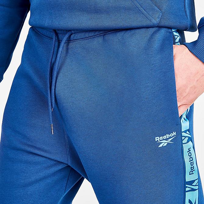 On Model 5 view of Men's Reebok Identity Tape Jogger Pants in Batik Blue Click to zoom