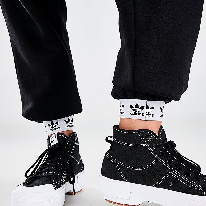 On Model 6 view of Women's adidas Originals Tape Jogger Pants in Black/White Click to zoom