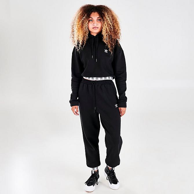 Front Three Quarter view of Women's adidas Originals Tape Cropped Hoodie in Black Click to zoom