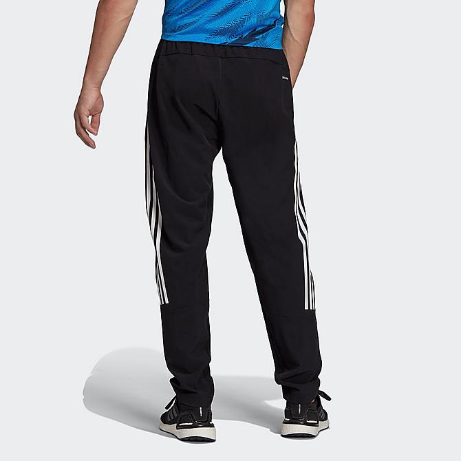 Front Three Quarter view of Men's adidas Train Icons Training Jogger Pants in Black Click to zoom