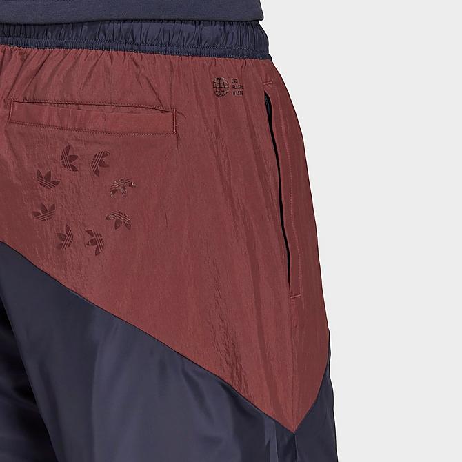 On Model 6 view of Men's adidas Originals Adicolor Colorblock Track Pants in Shadow Navy/Quiet Crimson/Collegiate Green Click to zoom
