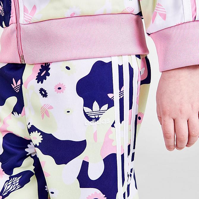 [angle] view of Girls' Infant and Toddler adidas Originals HER Studio London Floral Allover Print SST Track Jacket and Pants Set in White/True Pink/Almost Lime/Legacy Indigo Click to zoom