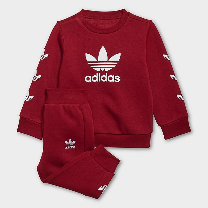 Front view of Kids' Infant and Toddler adidas Originals Repeat Trefoil Crewneck Sweatshirt and Jogger Pants Set in Collegiate Burgundy Click to zoom