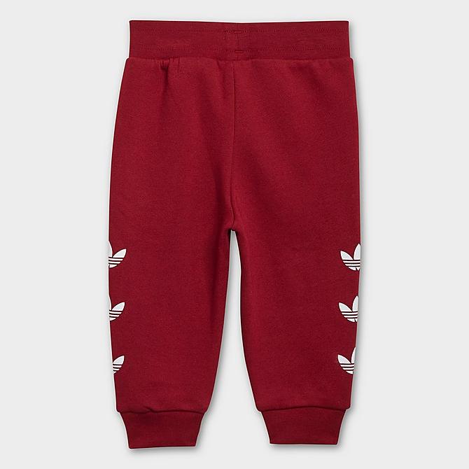 On Model 5 view of Kids' Infant and Toddler adidas Originals Repeat Trefoil Crewneck Sweatshirt and Jogger Pants Set in Collegiate Burgundy Click to zoom
