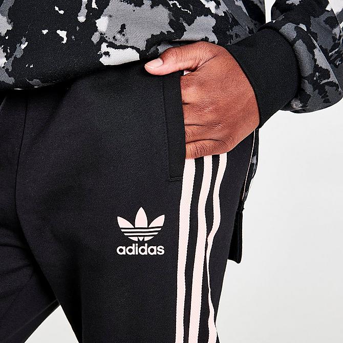 On Model 5 view of Girls' adidas Originals 3-Stripes Jogger Pants in Black/Pink Click to zoom