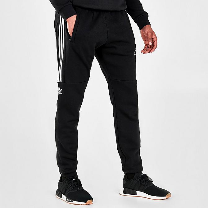 Front Three Quarter view of Men's adidas Originals Sticker Pack Jogger Pants in Black Click to zoom