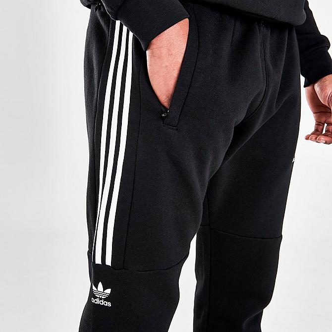 On Model 5 view of Men's adidas Originals Sticker Pack Jogger Pants in Black Click to zoom