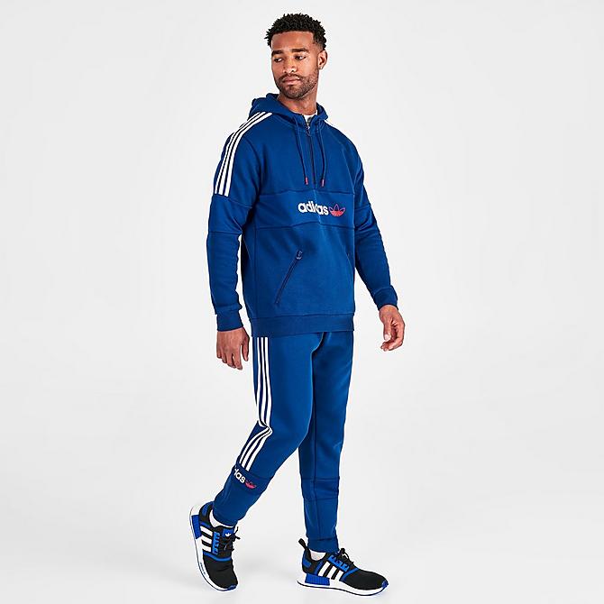 Front Three Quarter view of Men’s adidas Originals Itasca Fleece Jogger Pants in Mystery Blue Click to zoom