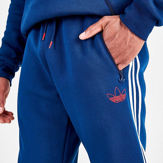 On Model 5 view of Men’s adidas Originals Itasca Fleece Jogger Pants in Mystery Blue Click to zoom