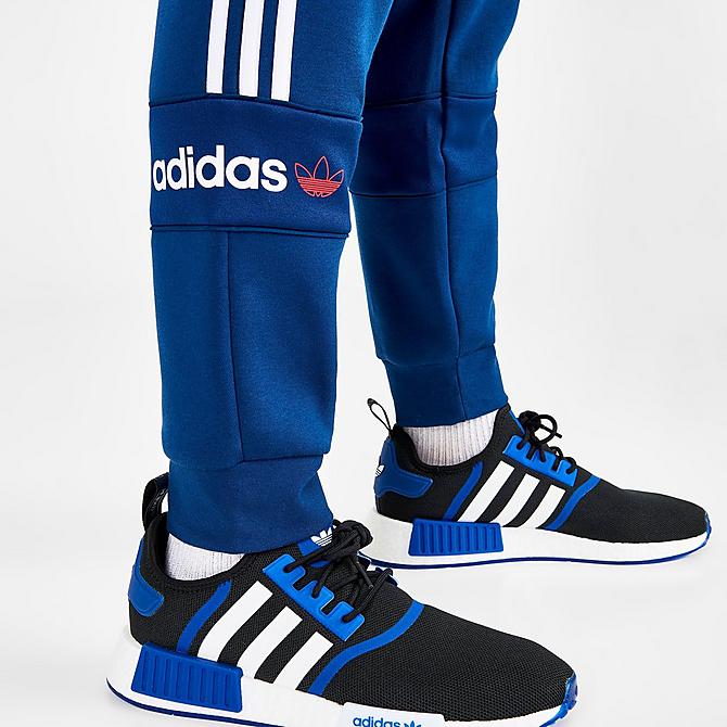 On Model 6 view of Men’s adidas Originals Itasca Fleece Jogger Pants in Mystery Blue Click to zoom