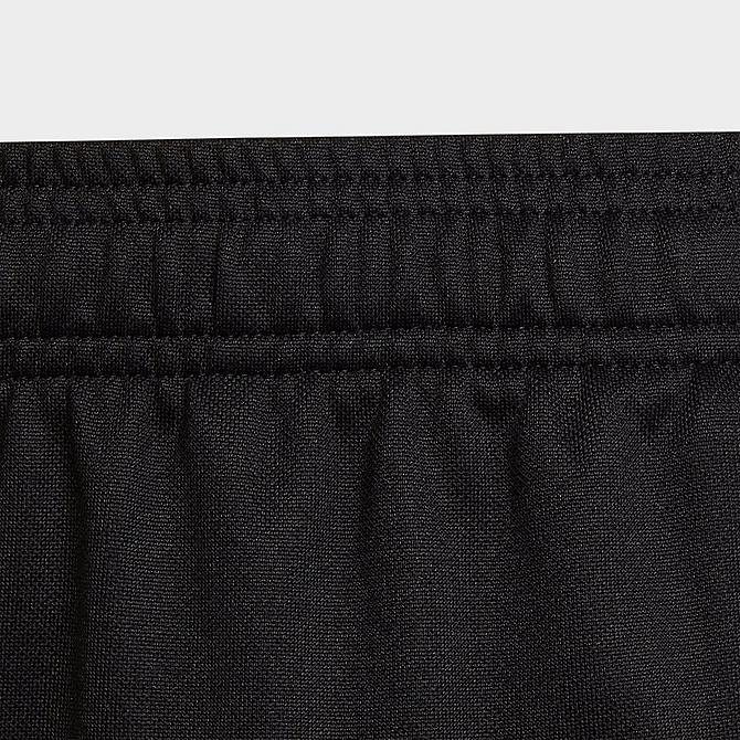 On Model 5 view of Kids' adidas Tiro Recycled Track Pants in Black Click to zoom
