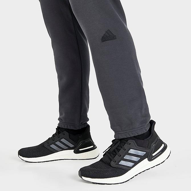 On Model 6 view of Women's adidas New Sportswear Logo Fleece Jogger Pants (Plus Size) in Carbon Click to zoom