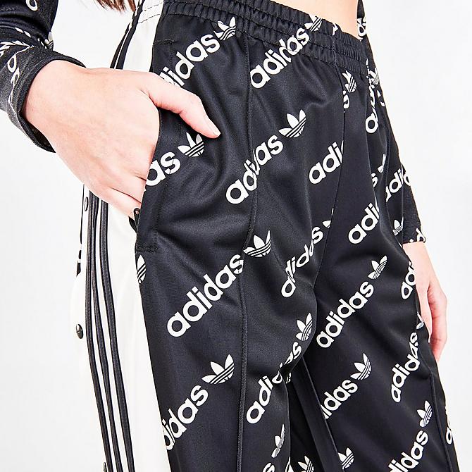 On Model 5 view of Women's adidas Originals Adibreak Monogram Track Pants in Black Click to zoom