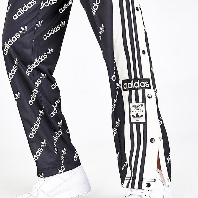 On Model 6 view of Women's adidas Originals Adibreak Monogram Track Pants in Black Click to zoom