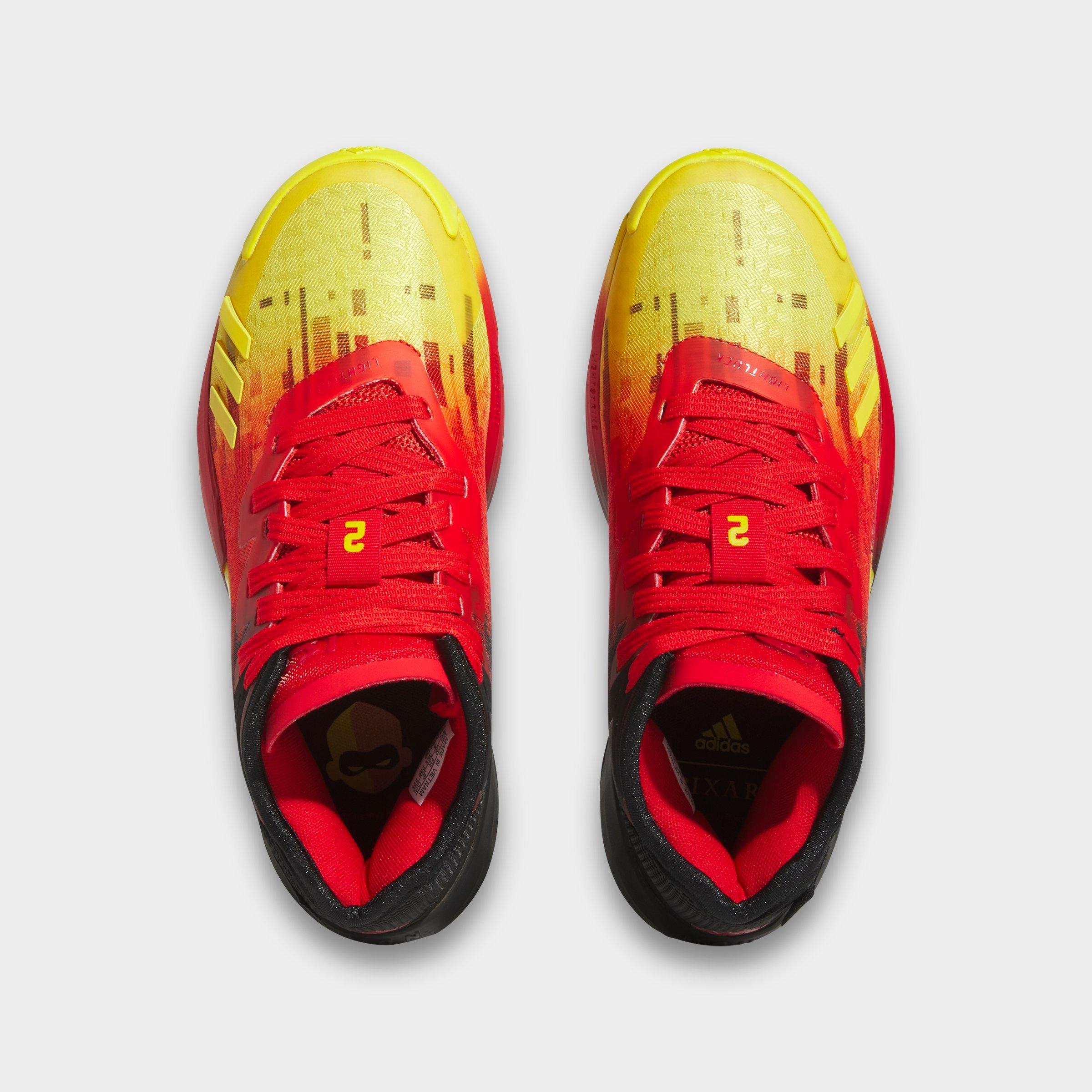 Adidas yellow and red basketball shoes