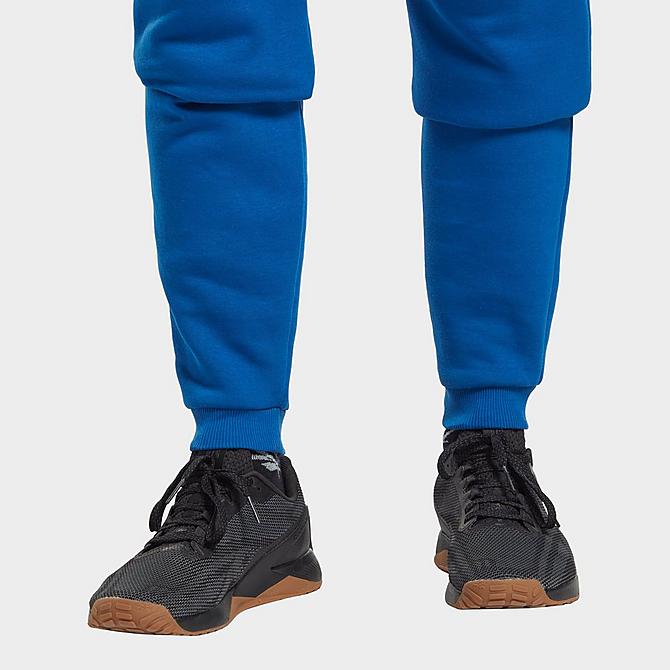 On Model 5 view of Men's Reebok Identity Fleece Jogger Pants in Vector Blue Click to zoom