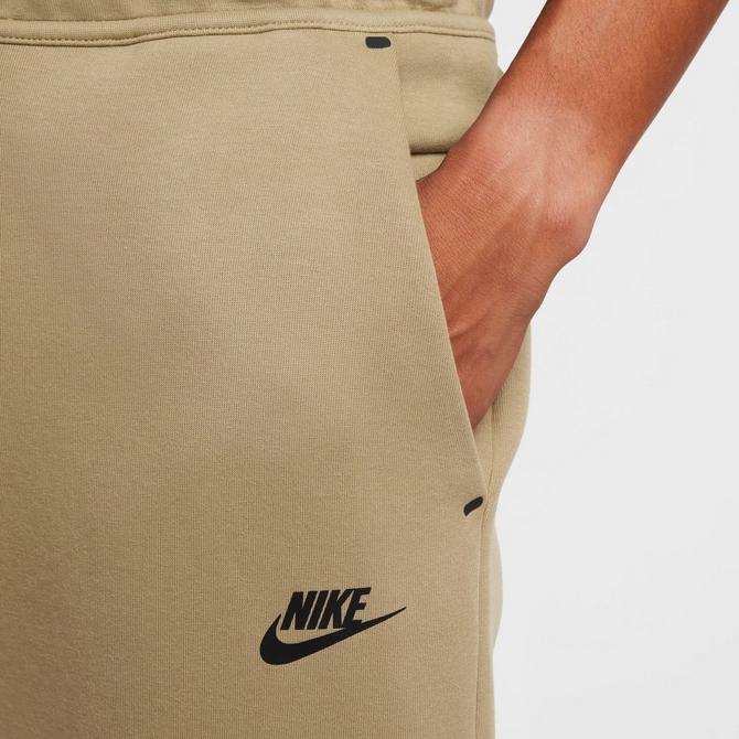 [angle] view of Men's Nike Tech Fleece Jogger Pants in Neutral Olive/Black Click to zoom