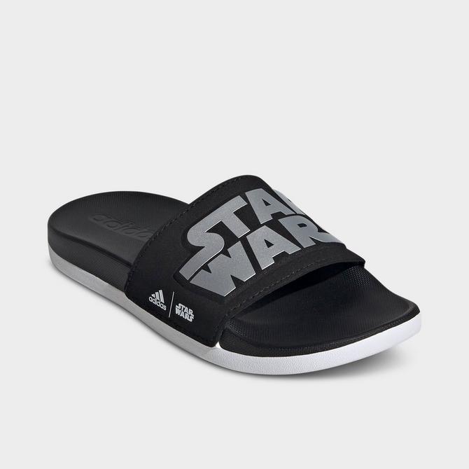 Three Quarter view of Little Kids' adidas x Star Wars adilette Comfort Slides in Core Black/Silver Metallic/Footwear White Click to zoom