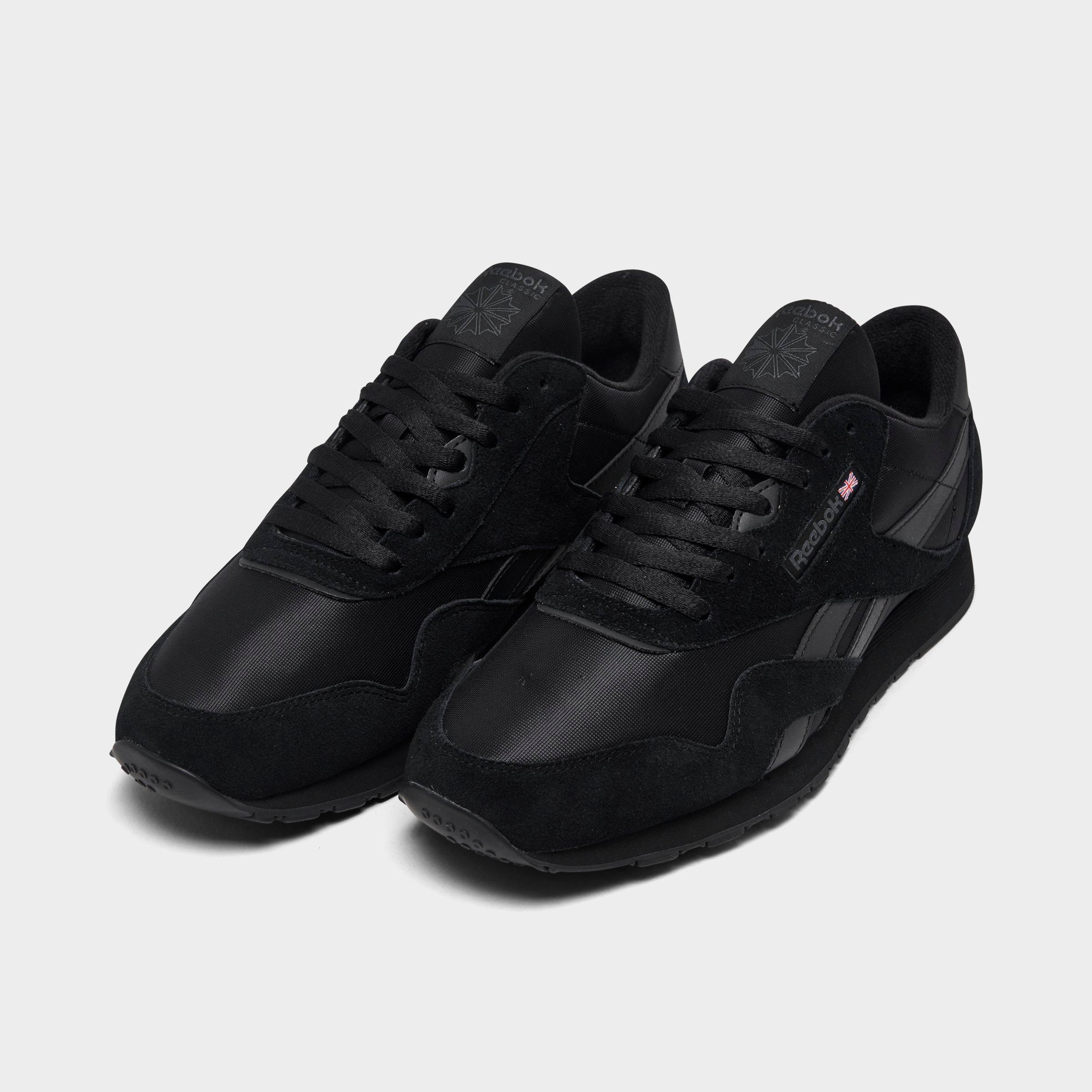 Plain black reebok outlet trainers