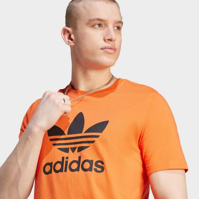orange and black adidas shirt