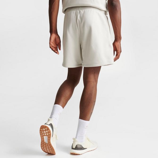 For college basketball players, long shorts might finally be taking a seat