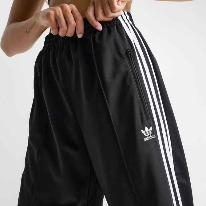 [angle] view of Women's adidas Originals Firebird Loose Track Pants in Black Click to zoom