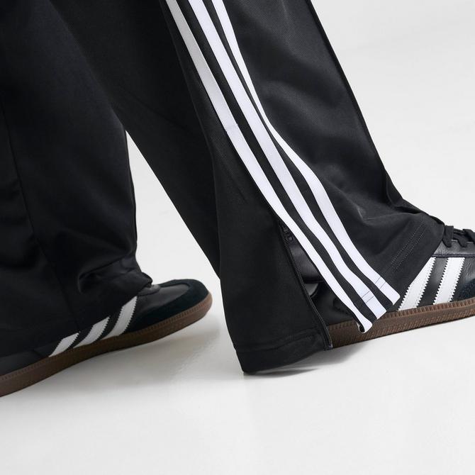 [angle] view of Women's adidas Originals Firebird Loose Track Pants in Black Click to zoom
