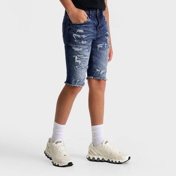 [angle] view of Kids' Jordan Craig Ripped Denim Shorts in Deep Blue Click to zoom