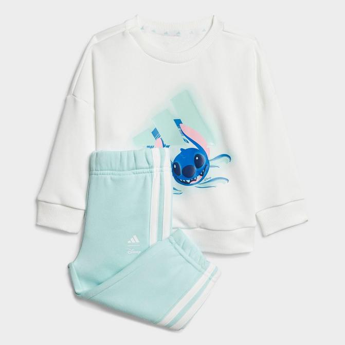 [angle] view of Infant and Toddler adidas x Disney Lilo And Stitch Sweatshirt and Jogger Pants Set in White/Semi Flash Aqua Click to zoom