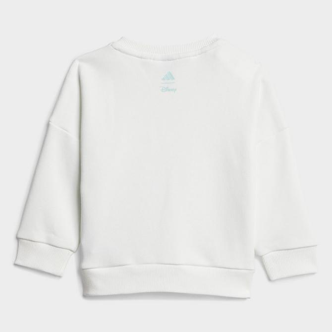 [angle] view of Infant and Toddler adidas x Disney Lilo And Stitch Sweatshirt and Jogger Pants Set in White/Semi Flash Aqua Click to zoom