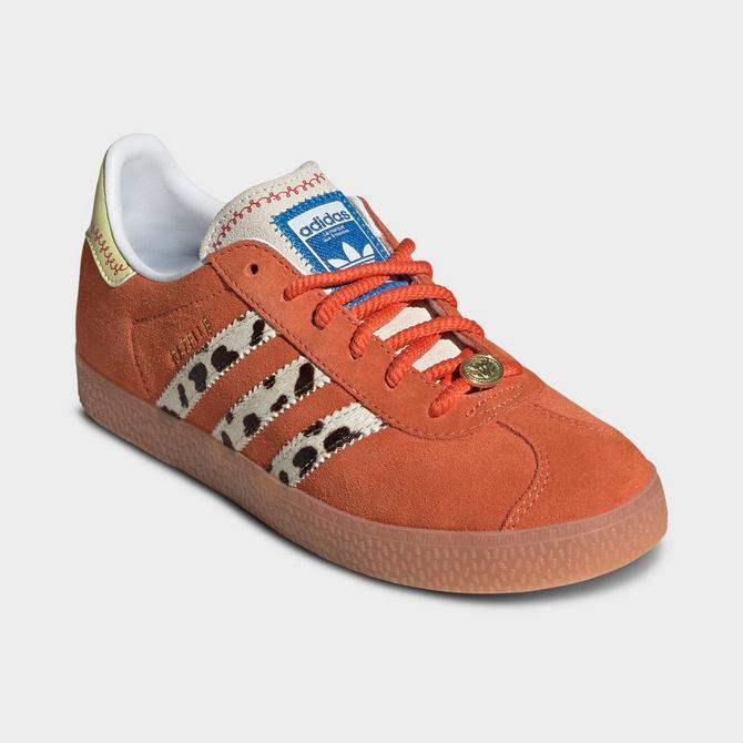Three Quarter view of Big Kids' adidas Originals x Toy Story Gazelle R Casual Shoes in Orange/White/Gum Click to zoom