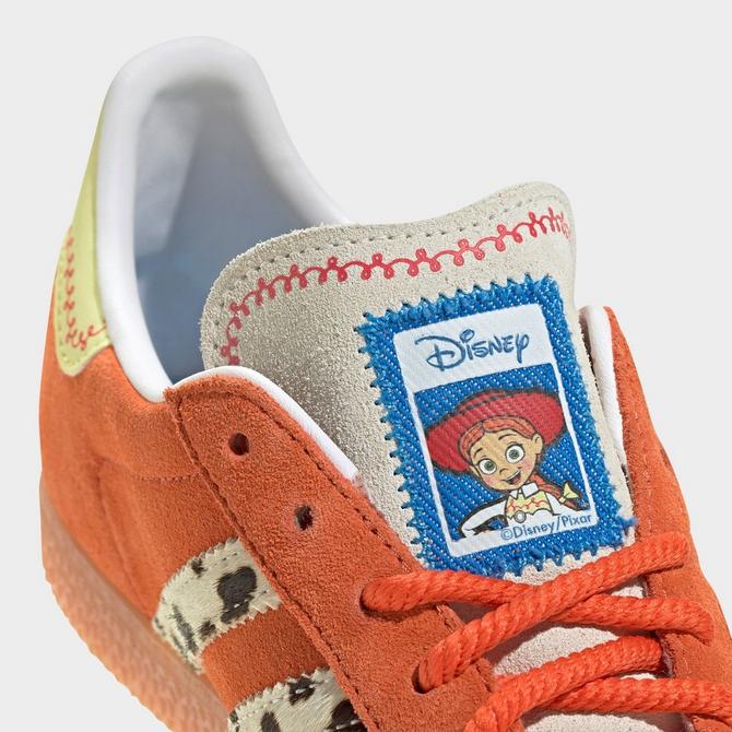 Front view of Big Kids' adidas Originals x Toy Story Gazelle R Casual Shoes in Orange/White/Gum Click to zoom