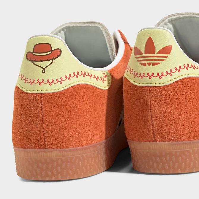 Left view of Little Kids' adidas Originals x Toy Story Gazelle Casual Shoes in Orange/White/Gum Click to zoom