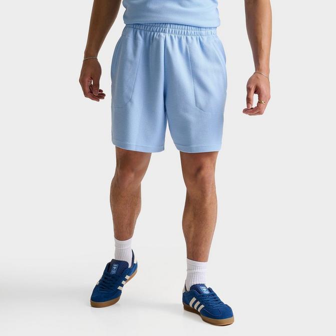 [angle] view of Men's adidas Originals Trefoil Essentials 7" Waffle Shorts in Clear Sky Click to zoom