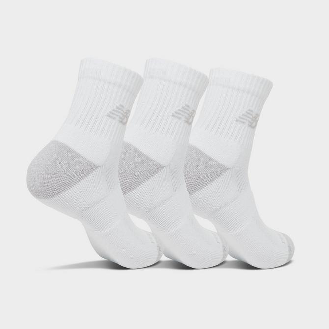 Three Quarter view of New Balance Active Quarter Socks (3-Pack) in Core White Click to zoom