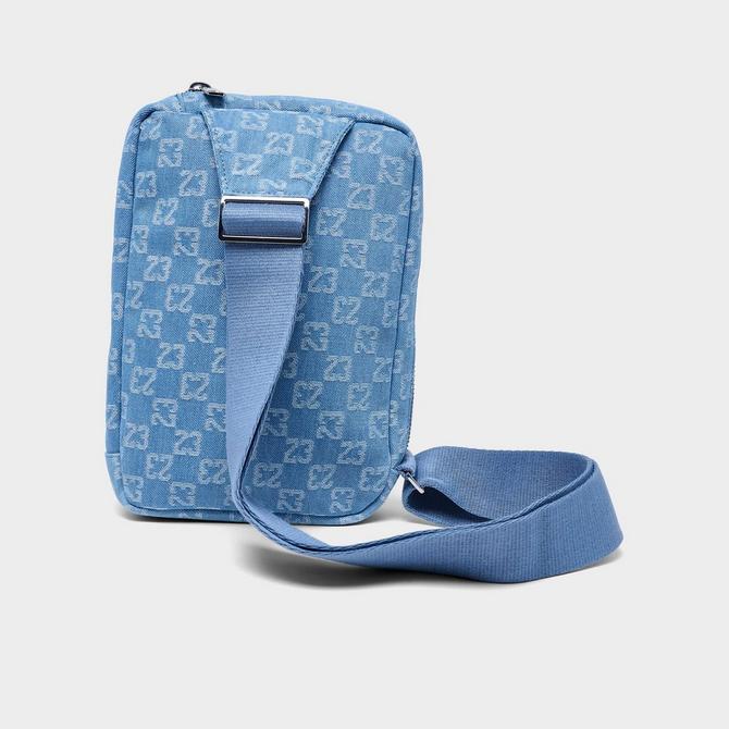 Left view of Jordan Monogram Sling Bag (3L) in Denim Click to zoom