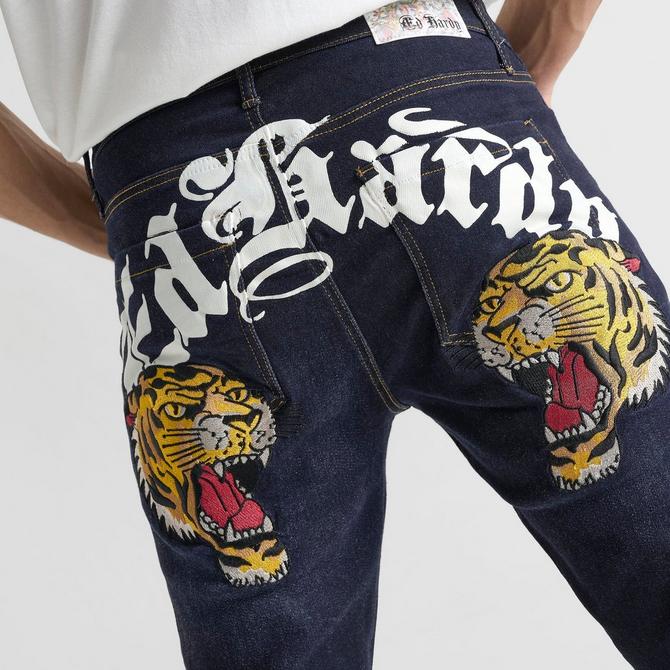 [angle] view of Men's Ed Hardy Tiger Heads Loose Fit Denim Jeans in Navy Blue Click to zoom