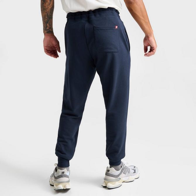 Men\'s New Balance Line Sweatpants Stacked Essentials Logo | Finish