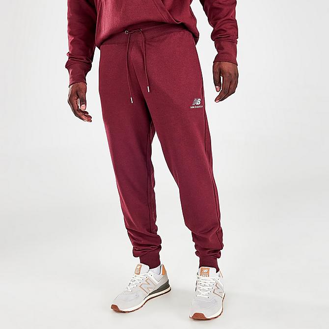 Front Three Quarter view of Men's New Balance Essentials Embroidered Graphic Jogger Pants in NB Burgundy Click to zoom