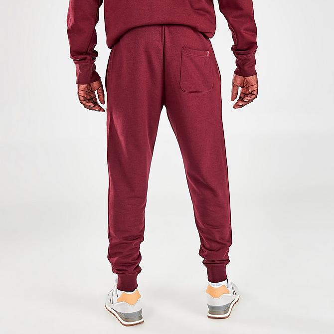 Back Right view of Men's New Balance Essentials Embroidered Graphic Jogger Pants in NB Burgundy Click to zoom