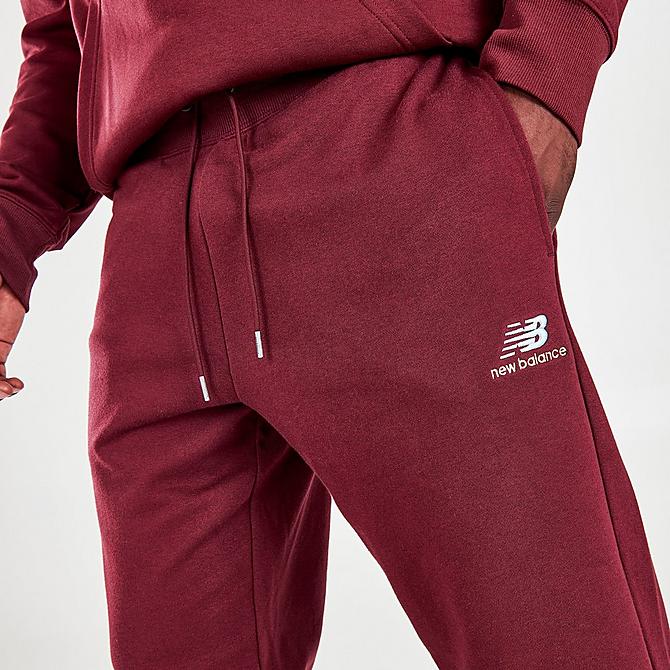On Model 5 view of Men's New Balance Essentials Embroidered Graphic Jogger Pants in NB Burgundy Click to zoom
