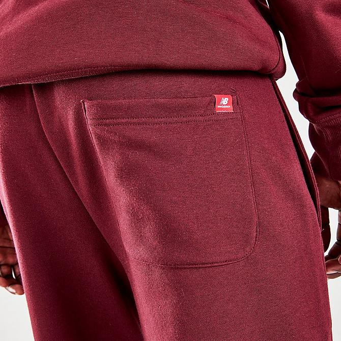 On Model 6 view of Men's New Balance Essentials Embroidered Graphic Jogger Pants in NB Burgundy Click to zoom