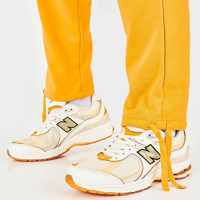 On Model 6 view of Men's New Balance Conversations Amongst Us Sweatpants in Aspen Click to zoom